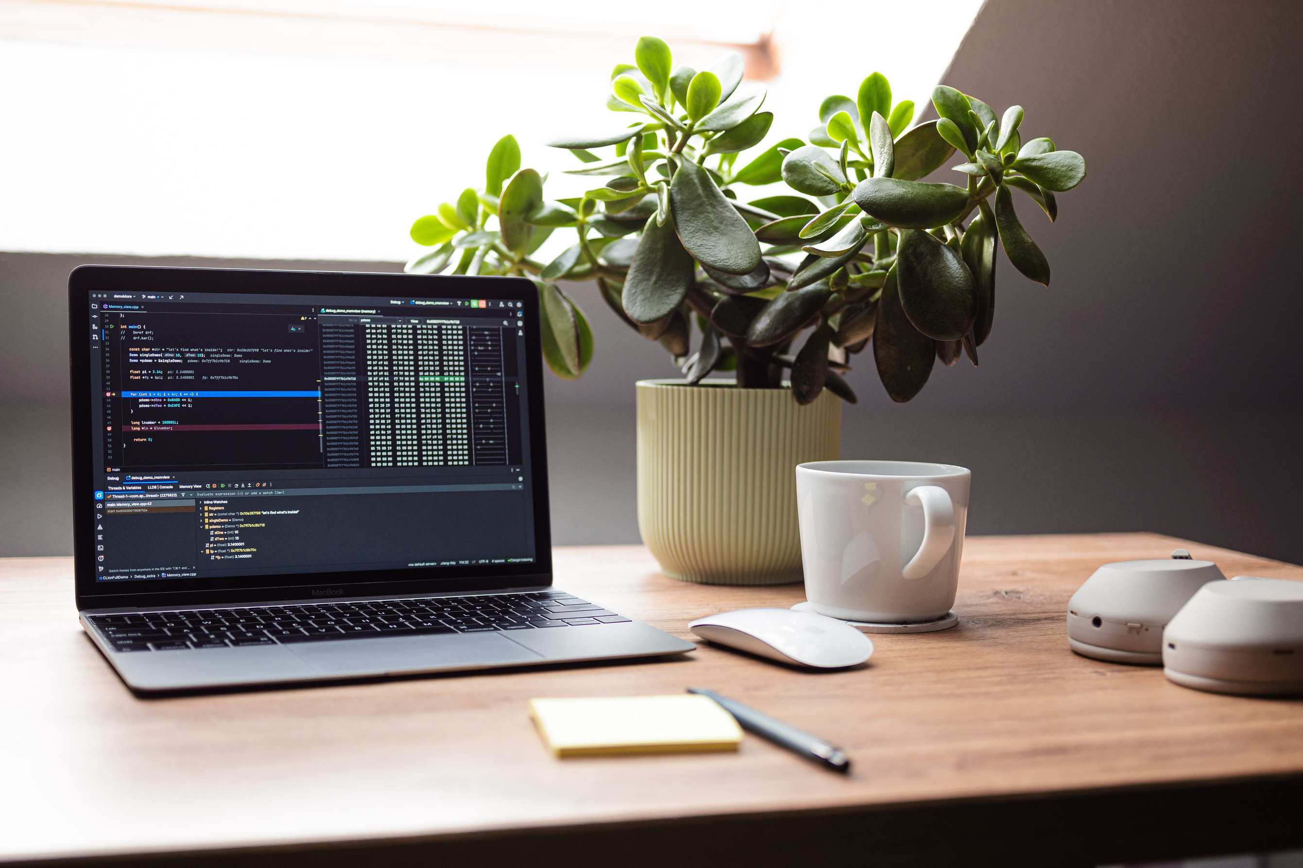 Developer workspace with laptop open on a desk